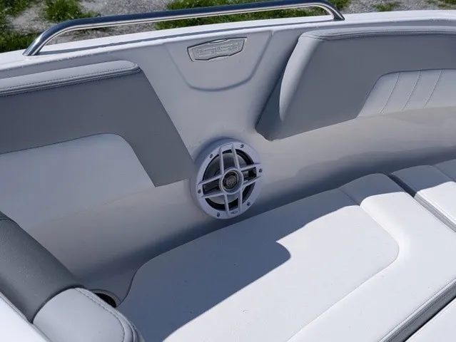 Slide: The Image of The image shows the interior of a Chaparral 23 SSi boat with white upholstery and a speaker. - 18