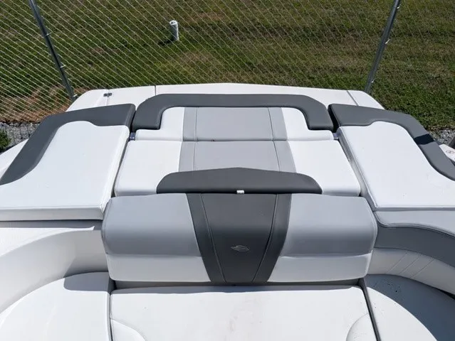 Slide: The Image of The image shows the padded sun deck of a 2026 Chaparral 23 SSi boat. - 29