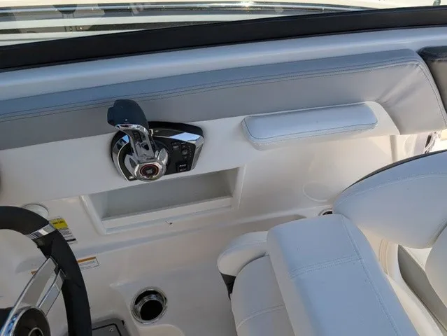 Slide: The Image of The image shows the cockpit of a Chaparral 23 SSi boat with a modern throttle control. - 28
