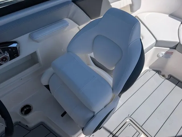 Slide: The Image of A luxurious, white upholstered boat seat with armrests in a modern cockpit. - 27