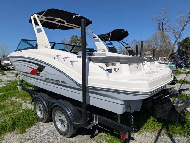 Slide: The Image of A white 2026 Chaparral 23 SSi boat is on a trailer outdoors. - 11