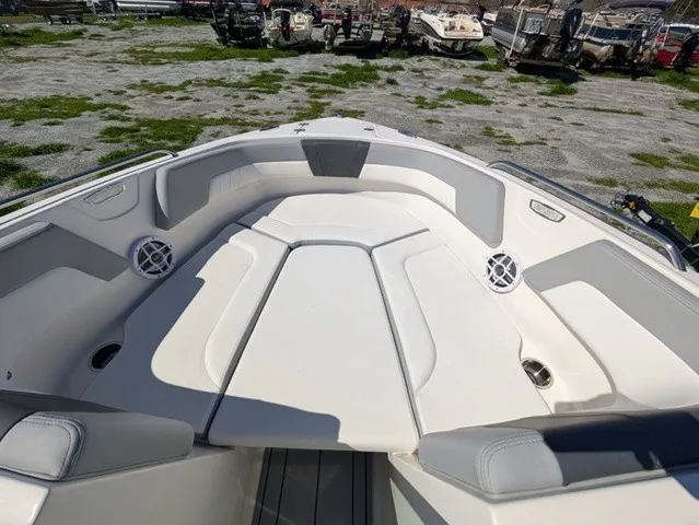 Slide: The Image of The image shows the bow area of a Chaparral 23 SSi boat with cushioned seating. - 17