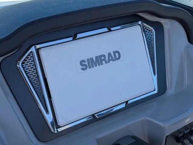 Slide: The Image of The image shows a Simrad navigation system in a Chaparral 23 SSi boat. - 21