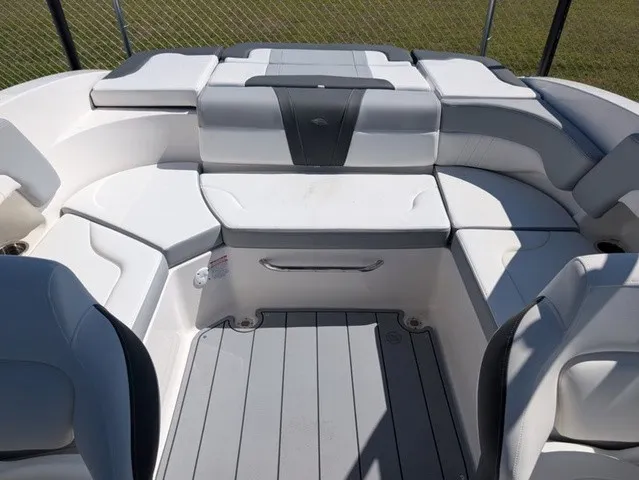 Slide: The Image of The image shows the cockpit of a Chaparral 23 SSi boat with white and gray upholstery. - 25