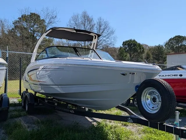 Slide: The Image of A white Chaparral 23 SSi boat from 2026 is on a trailer outdoors. - 8