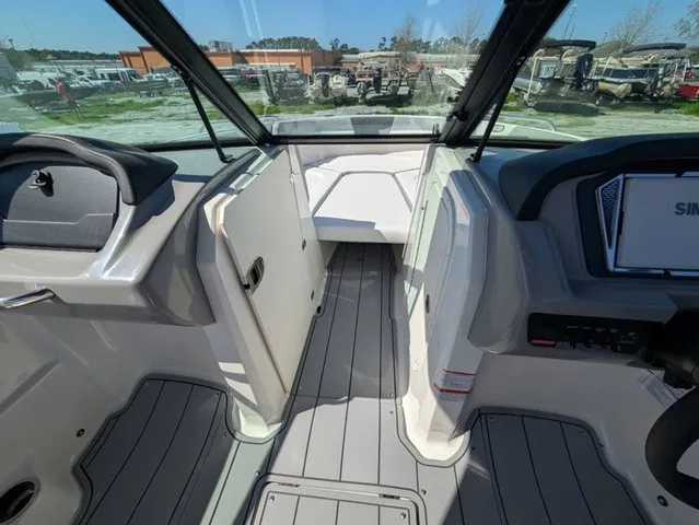 Slide: The Image of The image shows the cockpit of a Chaparral 23 SSi boat with gray flooring and modern instruments. - 16