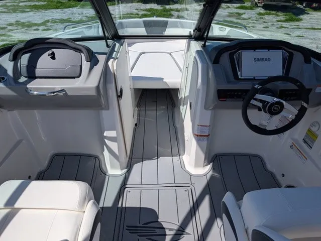 Slide: The Image of The image shows the cockpit of a Chaparral 23 SSi boat with modern instruments and gray flooring. - 20