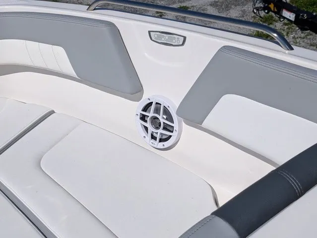 Slide: The Image of The image shows the interior of a Chaparral 23 SSi boat with gray and white upholstery. - 19