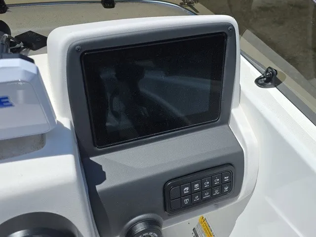 Slide: The Image of The image shows a modern boat dashboard with a large screen and several switches. - 20
