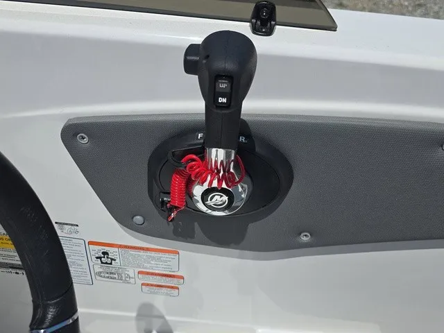 Slide: The Image of Close-up of a boat throttle lever with safety lanyard, mounted on a gray panel. - 21