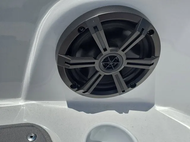 Slide: The Image of Close-up of a speaker on a boat, mounted in a white surface. - 13