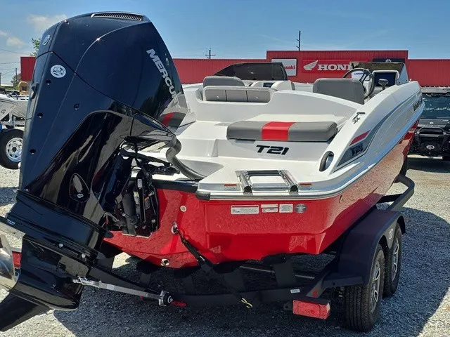 Slide: The Image of The image shows a red 2026 Tahoe T21 boat with a large outboard motor. - 6
