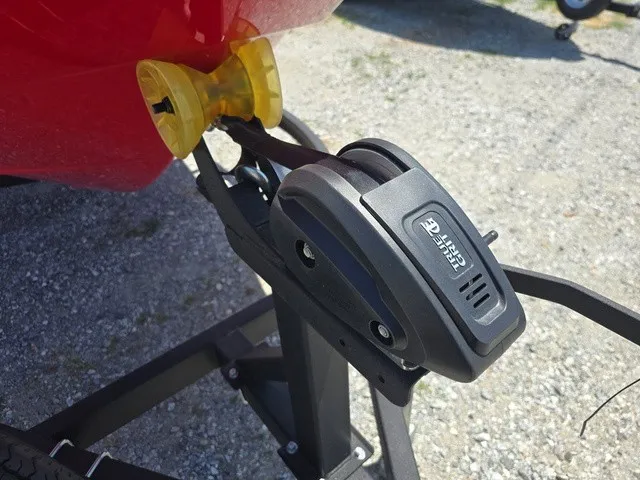 Slide: The Image of Close-up of a boat trailer with a winch attached to a red boat. - 31