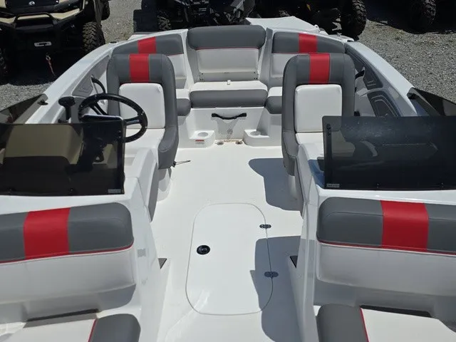 Slide: The Image of The image shows the cockpit of a modern boat with gray and red seating. - 15