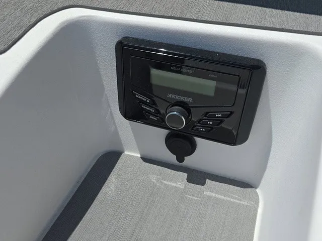 Slide: The Image of The image shows a modern media center in a boat, set into a white console. - 17