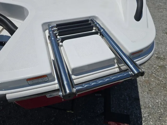 Slide: The Image of A stainless steel swim ladder is mounted on the stern of a white boat. - 29