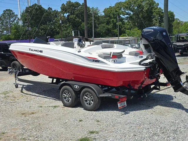 Slide: The Image of A red 2026 Tahoe T21 boat on a trailer, featuring an outboard motor. - 8