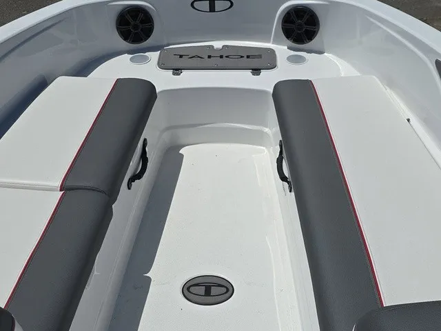 Slide: The Image of The image shows the interior of a 2026 Tahoe T21 boat with gray and red seating. - 11