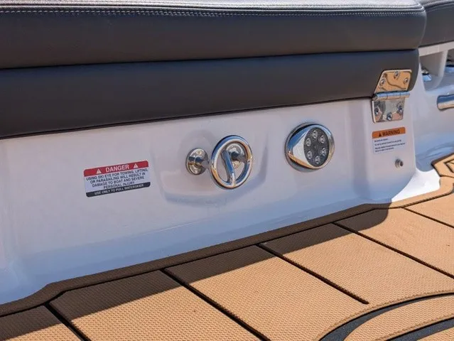 Slide: The Image of Close-up of the stern of a Chaparral 21 SSi boat with upholstery and controls. - 18