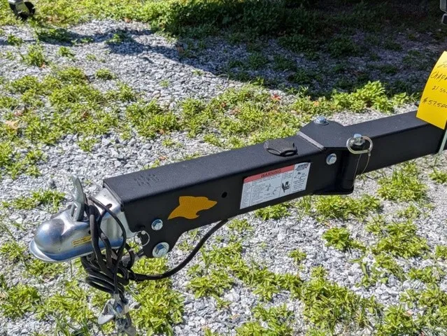 Slide: The Image of Close-up of a boat trailer on gravel and grass. - 5