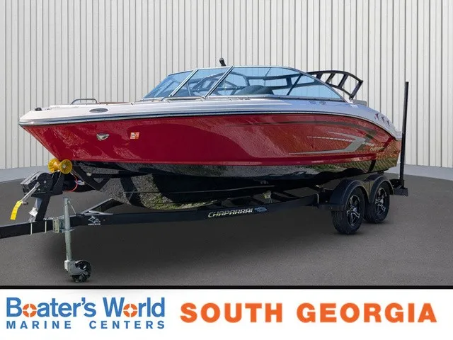The Image of Chaparral 21 SSi 2023 in bright red on a trailer, parked in front of a building. - 1