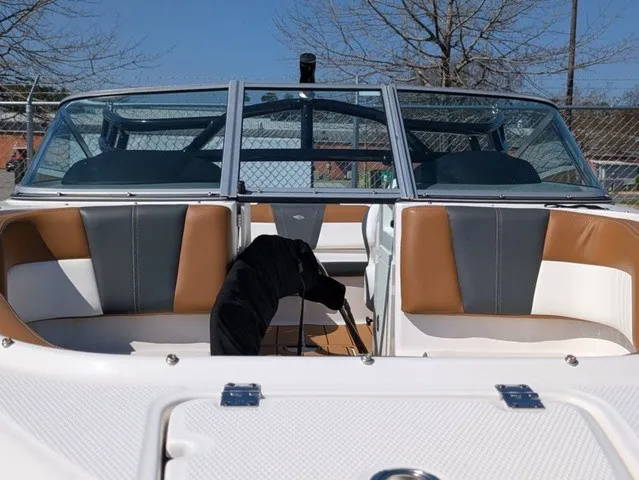 Slide: The Image of The image shows the cockpit of a 2023 Chaparral 21 SSi with two-tone seats and windshield. - 7