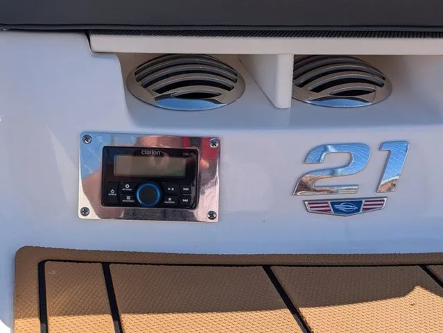 Slide: The Image of The image shows the stern of a Chaparral 21 SSi boat with an audio system and vents. - 17