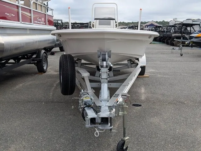 Slide: The Image of A 2026 Mako 18 Pro Skiff is on a trailer in a parking lot. - 3