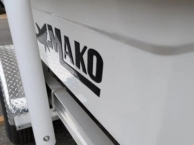 Slide: The Image of Close-up of the Mako logo on a white boat with aluminum step. - 16