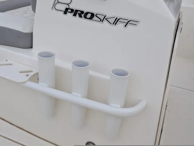 Slide: The Image of Close-up of three white rod holders on a Mako 18 Pro Skiff boat. - 25