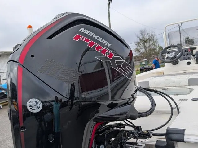 Slide: The Image of A Mercury Pro XS outboard motor is mounted on a Mako 18 Pro Skiff boat. - 13
