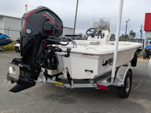 Slide: The Image of A 2026 Mako 18 Pro Skiff on a trailer. The outboard motor is prominently visible. - 12