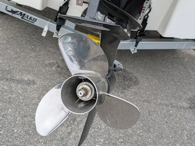 Slide: The Image of Close-up of a shiny propeller on a Mako 18 Pro Skiff boat. - 14