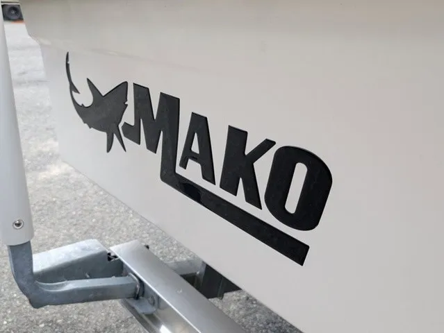 Slide: The Image of Close-up of the Mako logo on a boat hull, featuring a stylized shark. - 10
