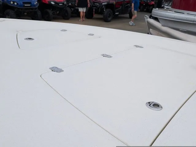 Slide: The Image of The image shows the deck of a Mako 18 Pro Skiff boat with hatches and fittings. - 26