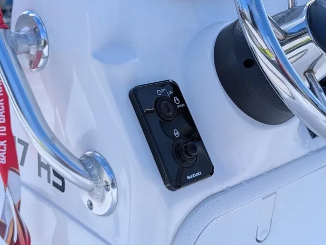 Slide: The Image of Close-up of a boat control panel with Suzuki switch and steering wheel. - 21