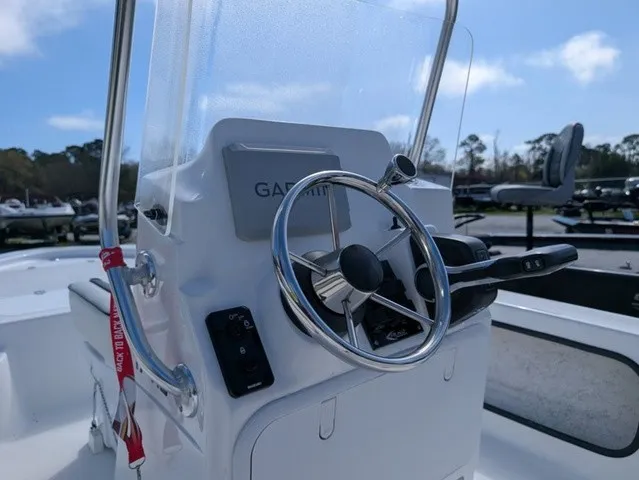 Slide: The Image of The image shows the helm of a 2025 ALK2 Powerboats 17 HS with a Garmin system. - 20