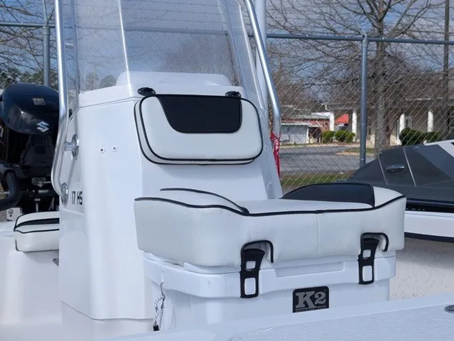 Slide: The Image of The image shows the cockpit of a 2025 ALK2 Powerboats 17 HS with white upholstery. - 7