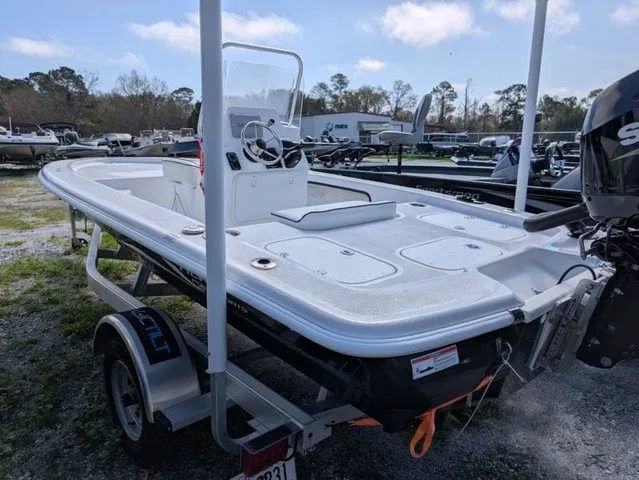 Slide: The Image of A white motorboat on a trailer, featuring a Suzuki outboard motor and a center console. - 15