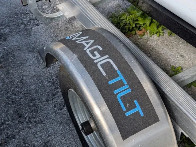 Slide: The Image of Close-up of a boat trailer with "MAGIC TILT" written on the fender. - 9
