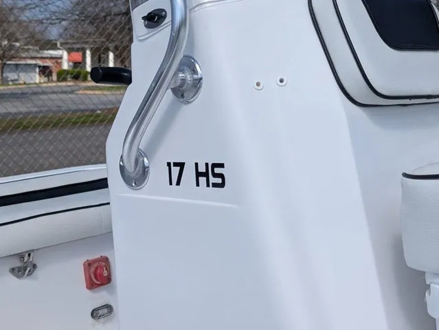 Slide: The Image of Close-up of a white boat with "17 HS" lettering and a metal handle. - 8
