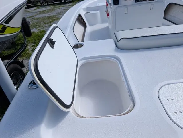 Slide: The Image of The image shows the deck of an ALK2 Powerboats 17 HS with an open storage compartment. - 17
