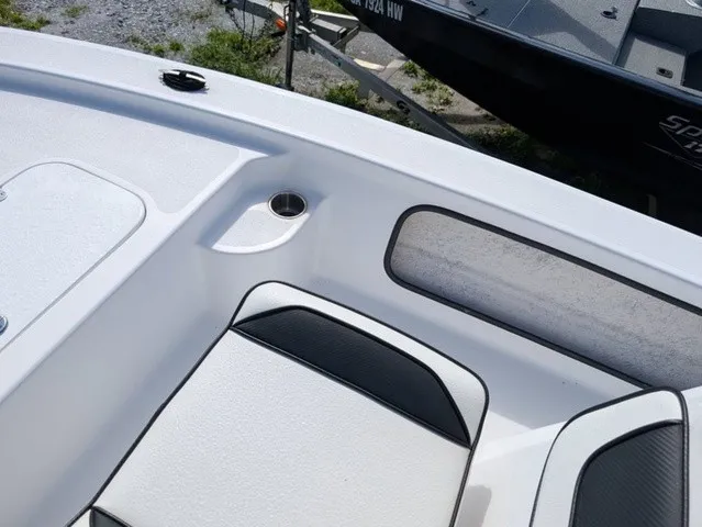 Slide: The Image of The image shows the cockpit of a 2025 ALK2 Powerboats 17 HS with white upholstery. - 30