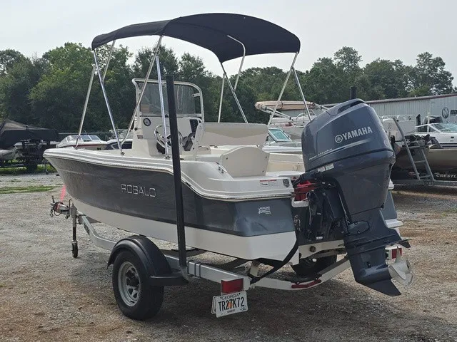 Slide: The Image of A 2016 Robalo R160 Center Console boat with Yamaha outboard motor, parked on a trailer. - 8