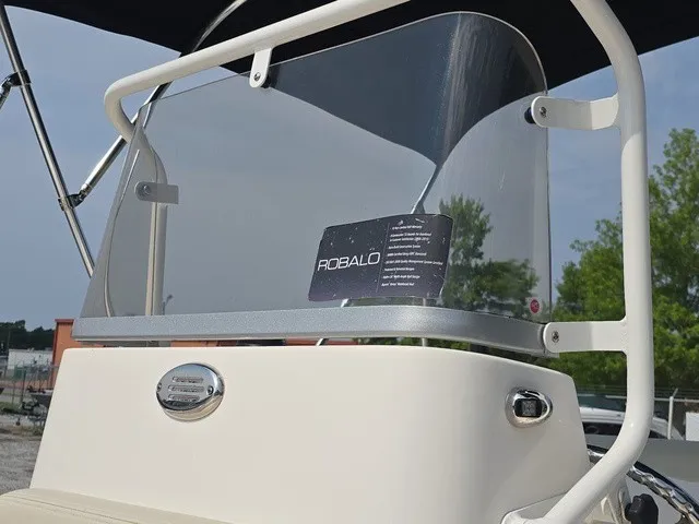 Slide: The Image of Close-up of the helm on a 2016 Robalo R160 Center Console boat. - 25