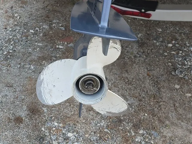 Slide: The Image of Close-up of a boat propeller on a gravel surface, showing signs of wear. - 19