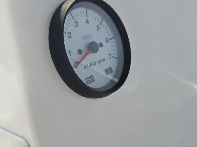 Slide: The Image of Close-up of a tachometer on a boat, displaying up to 7,000 RPM. - 24