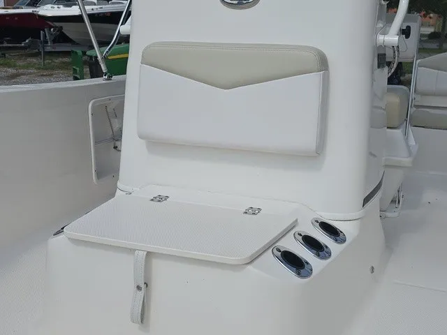 Slide: The Image of The image shows the helm of a 2016 Robalo R160 Center Console boat with seating. - 10