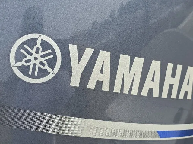 Slide: The Image of Close-up of the Yamaha logo on a boat engine. - 17