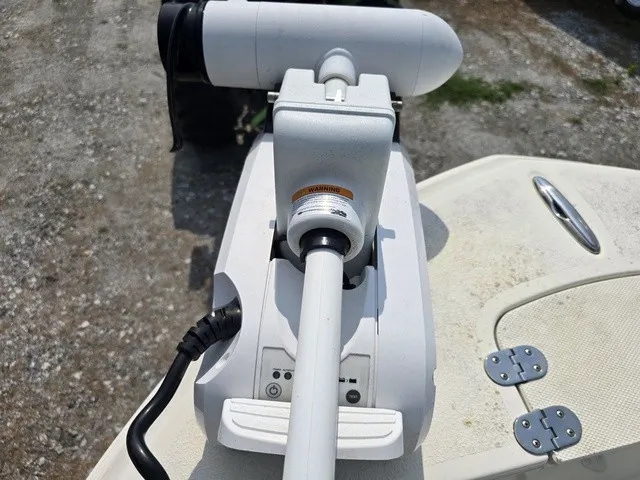 Slide: The Image of Close-up of a white boat motor on a 2023 Stingray 173 CC. - 31